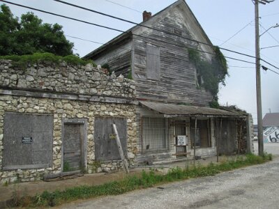 2024-10 Avilla - The two-story building used to be the Odd Fellows Lodge built in 1885, the single-story stone building used to be Old French’s Grocery Store by Randy Marco