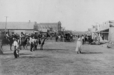 1906 Shamrock - Main street with First National Bank Building - Cicero Smith Lumber Yard is building on the left front side
